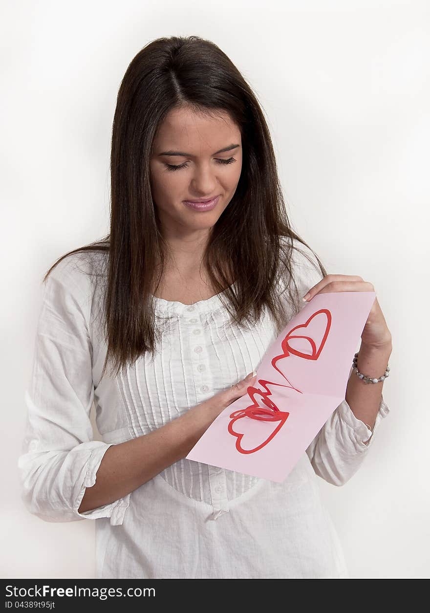 Young Girl With Card With Pop Up Hearts