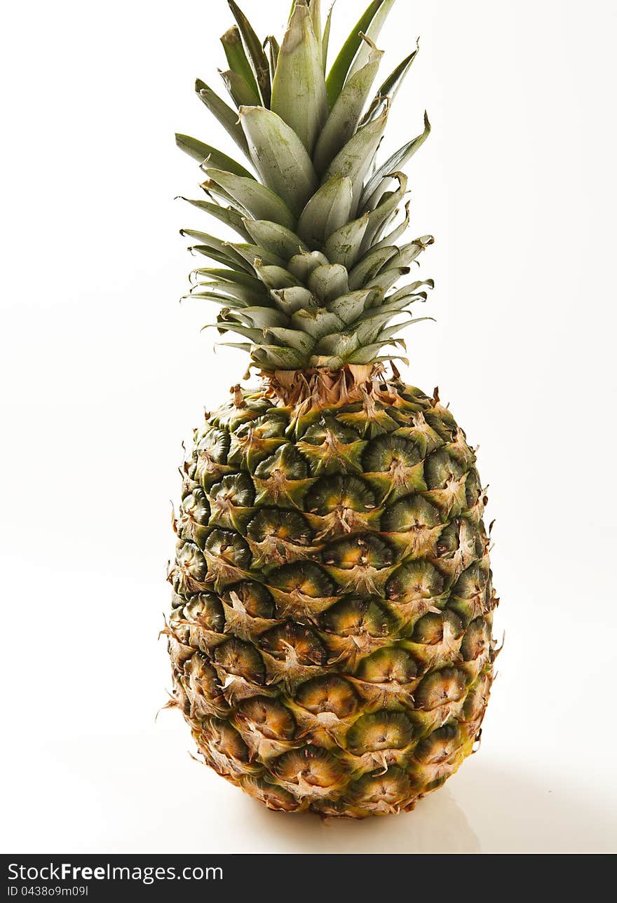 Fresh ripe pineapple photographed on white background. Fresh ripe pineapple photographed on white background