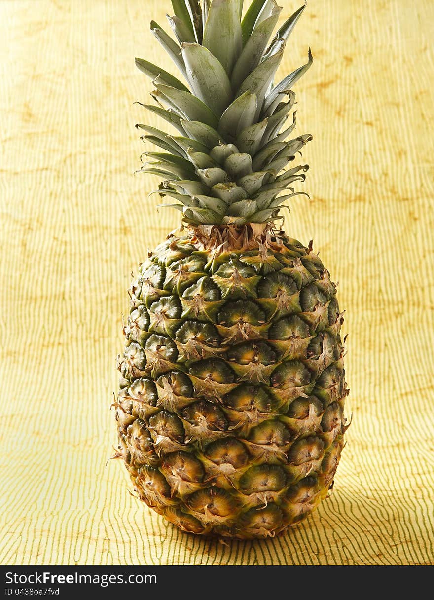 Fresh ripe pineapple photographed on colorful background. Fresh ripe pineapple photographed on colorful background