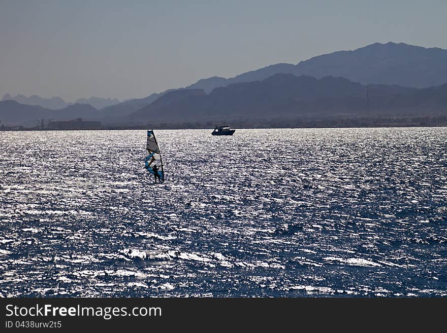 Silhouette of a windsurfer