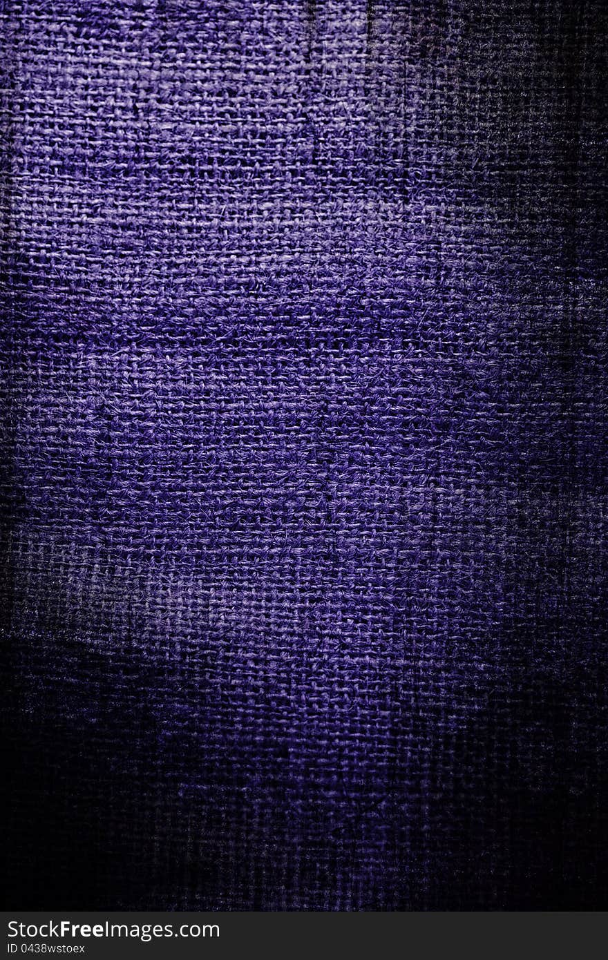 Fragment of rough violet textile background. Fragment of rough violet textile background