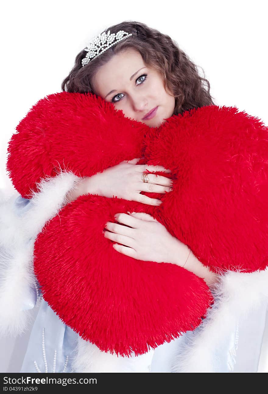 Girl hugs heart on a white background. Girl hugs heart on a white background