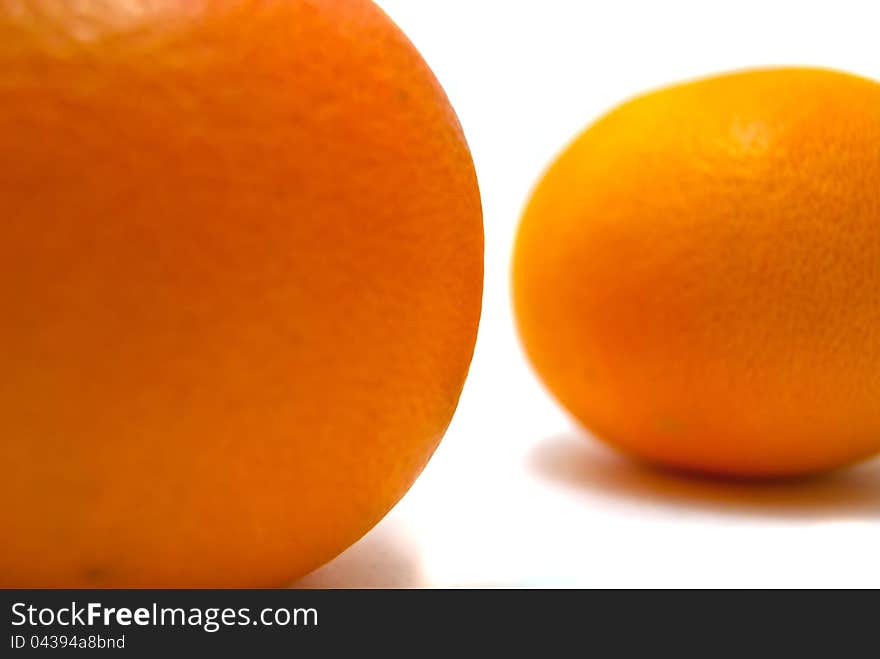 Two tangerine close-up on white