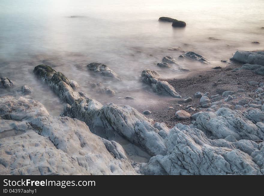 Seaside rocks, washed by waves, long-time exposure (~1min) hdr combined image. Seaside rocks, washed by waves, long-time exposure (~1min) hdr combined image