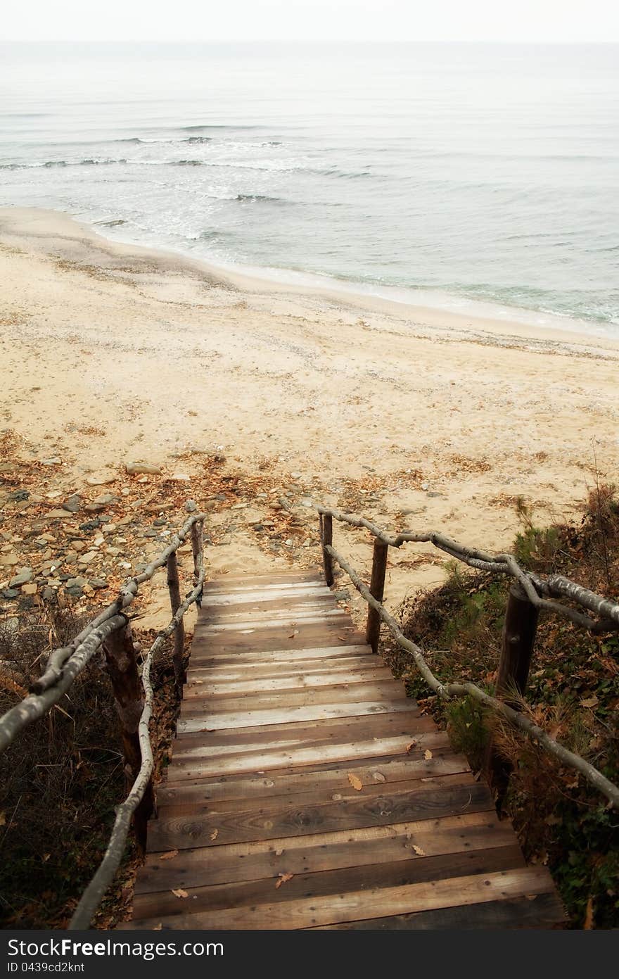 Wooden old stairs leading to the sea. Wooden old stairs leading to the sea