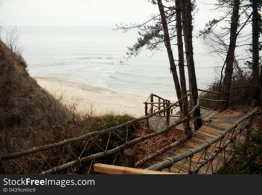 Wooden old stairs leading to the sea. Wooden old stairs leading to the sea