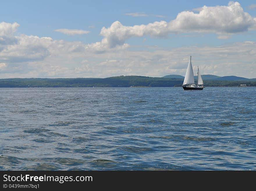 A beautiful sailboat on the ocean.