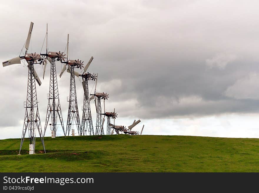 A photo of windmills. Converts wind mechanical energy to electrical energy. A photo of windmills. Converts wind mechanical energy to electrical energy.