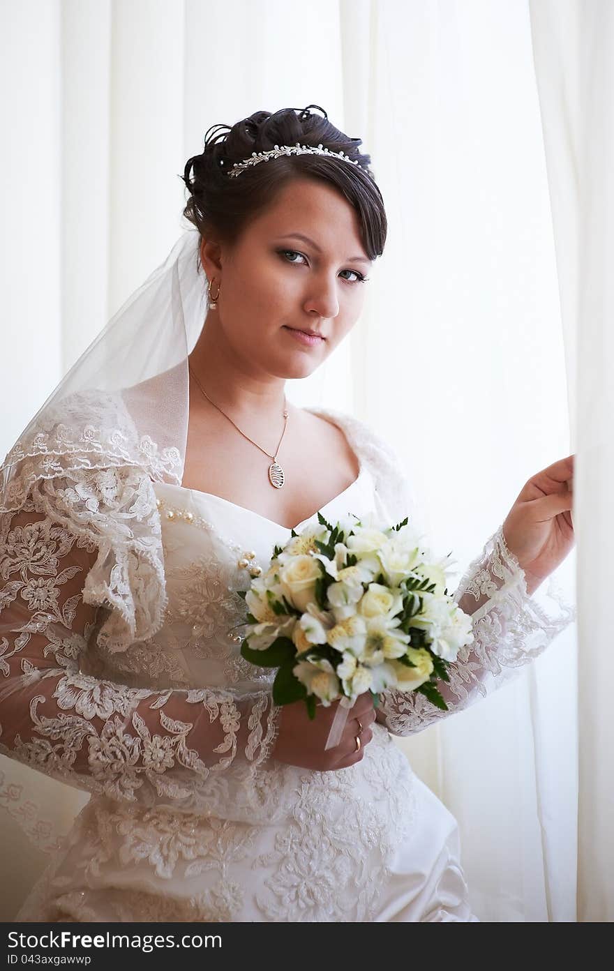 Happy bride with wedding bouquet