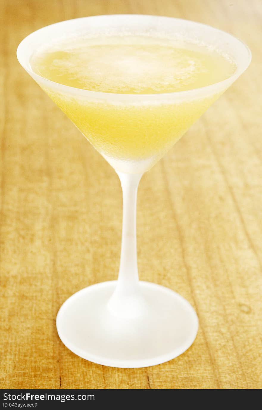 Orange colour cocktail on a wood background. Orange colour cocktail on a wood background