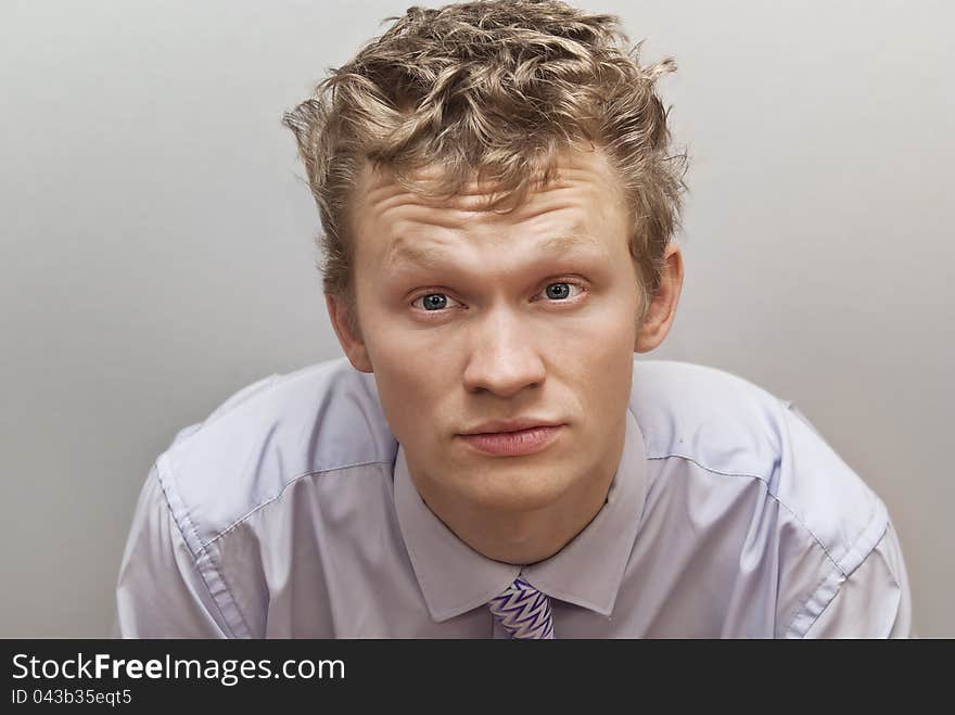 Expression guy on the grey background. Expression guy on the grey background