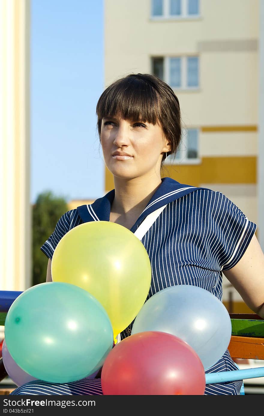 Portrait of a beautiful girl with balloons