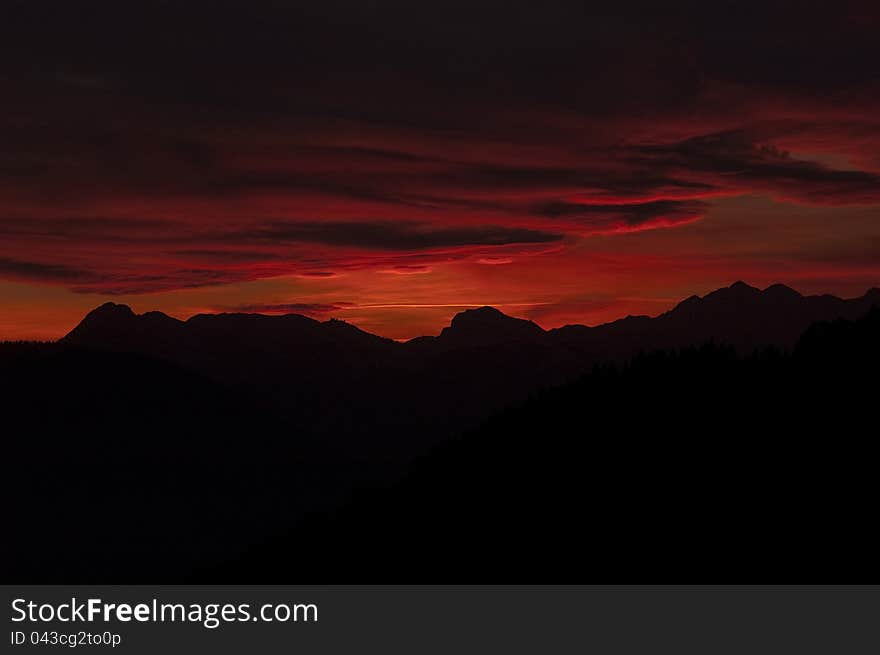 Red dramatic sunset on montain