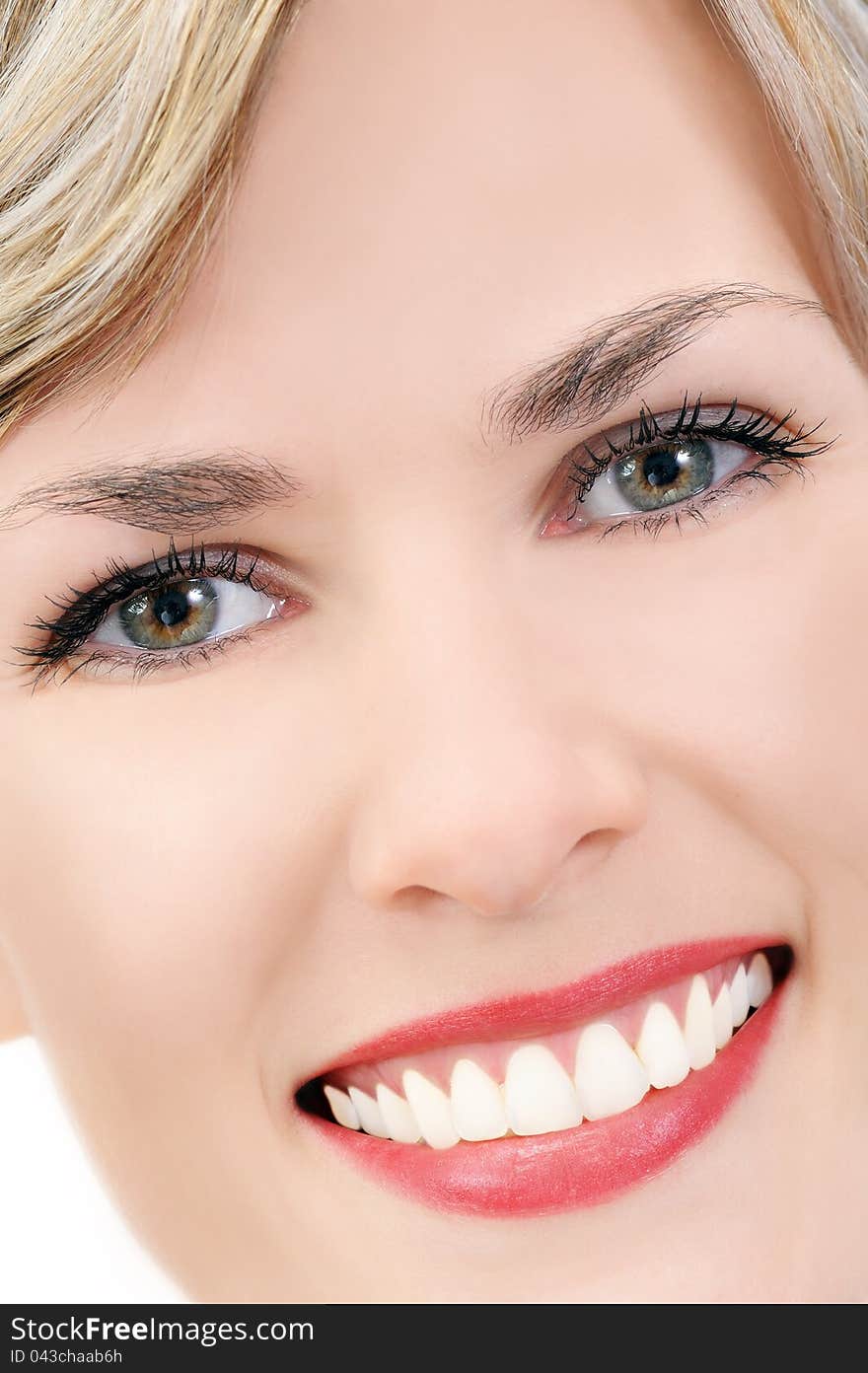 Close-up of a young beautiful caucasian smiling blonde woman, developed from Raw. Close-up of a young beautiful caucasian smiling blonde woman, developed from Raw