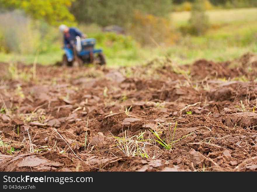 Tractor Ploughing on the Field