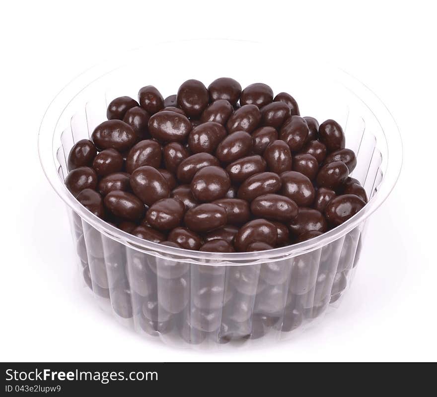 Dark brown dragee, chocolate covered nuts