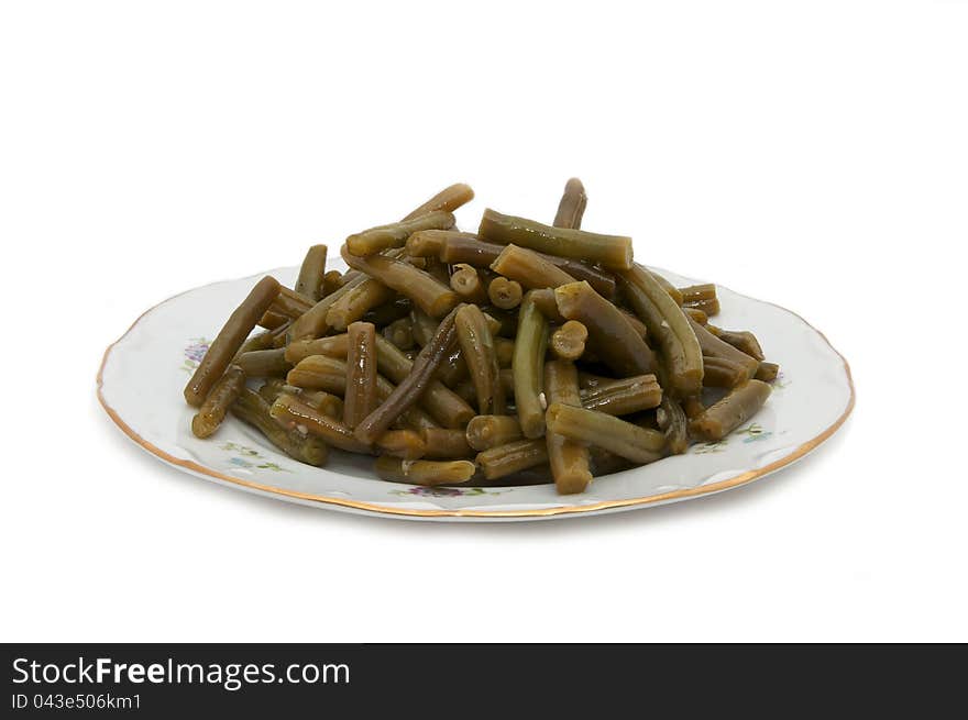 Dish a spicy salad of asparagus on a white background. Dish a spicy salad of asparagus on a white background