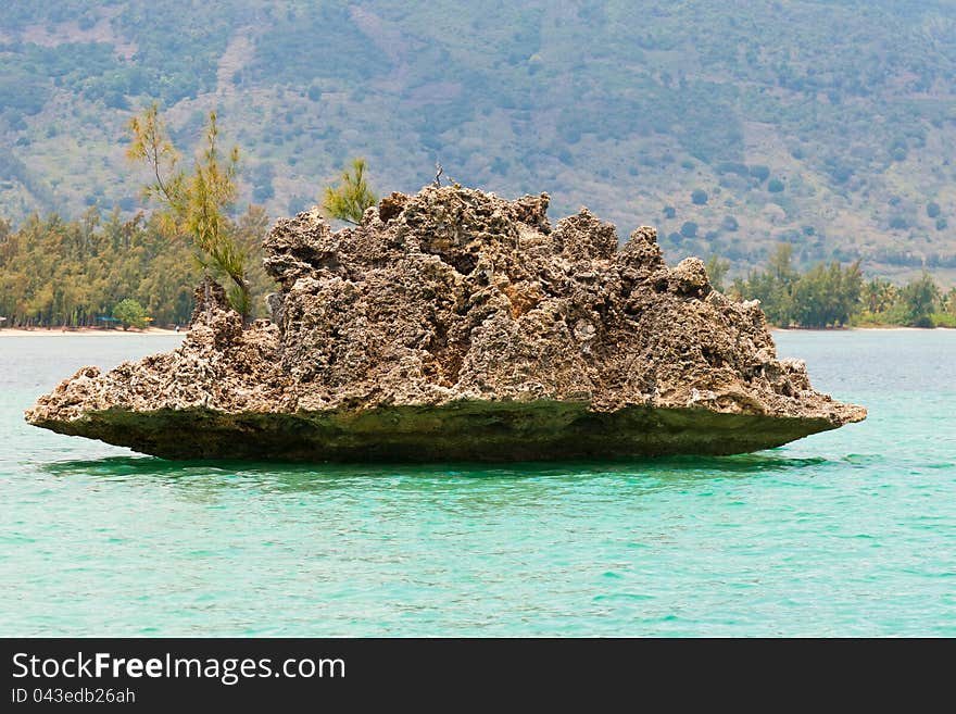 Crystal Rock at Mauritius in turquoise water. Crystal Rock at Mauritius in turquoise water