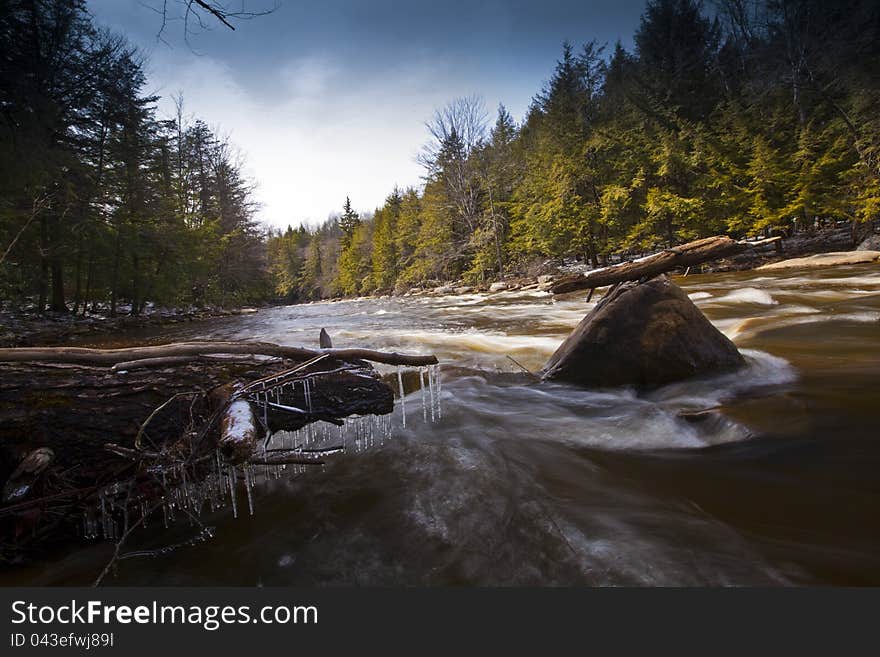 River And Rocks In The Mountains In Winter