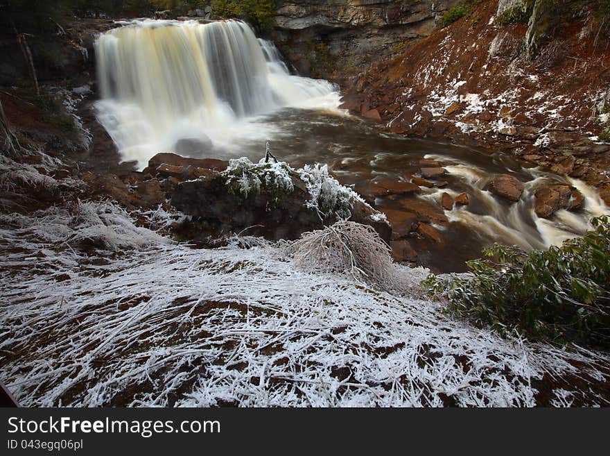 Silky waterfalls in the mountains in winter