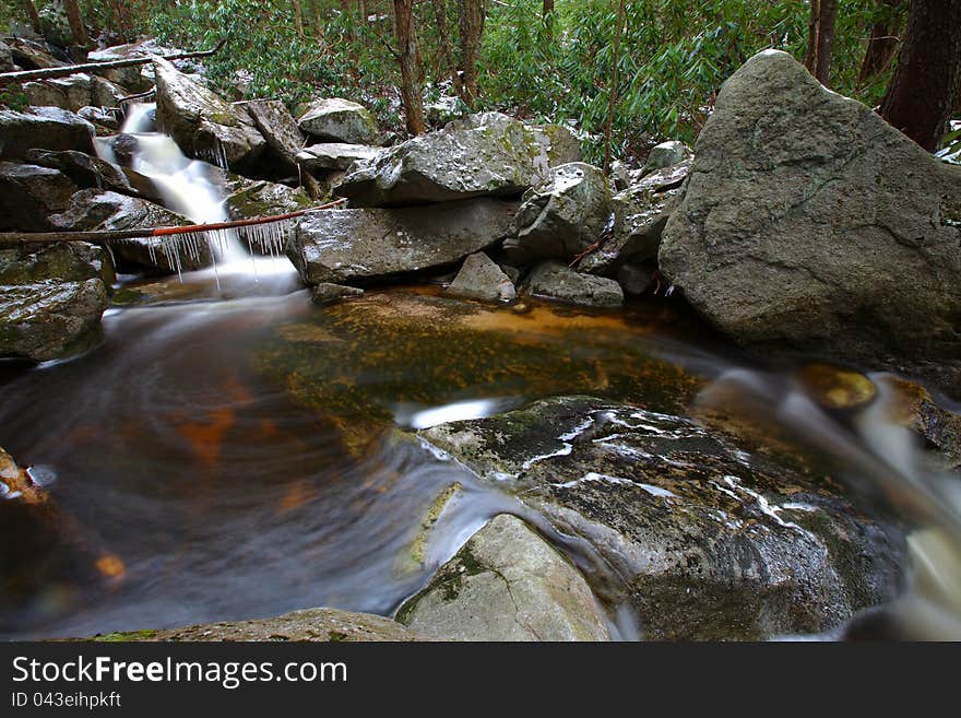 Silky waterfalls in the mountains in winter