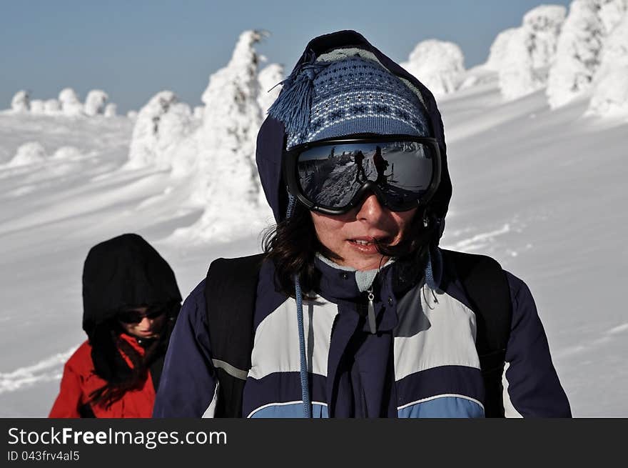 Female skier with sunglasses at winter