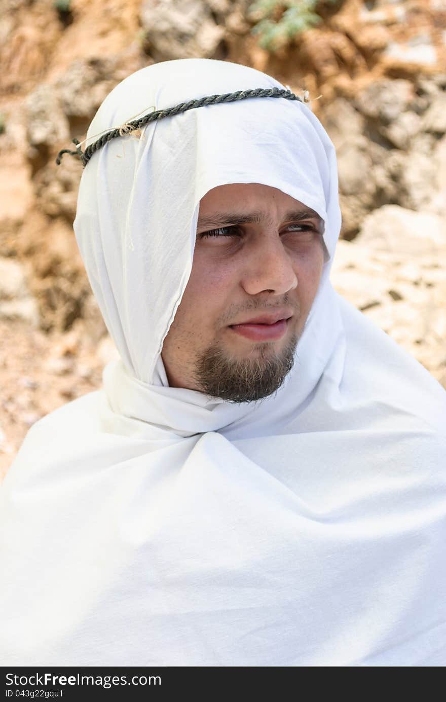 Intently looking, bearded man in Arab dress