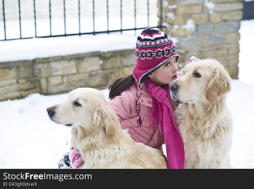 Little girl playing with her dogs. Little girl playing with her dogs