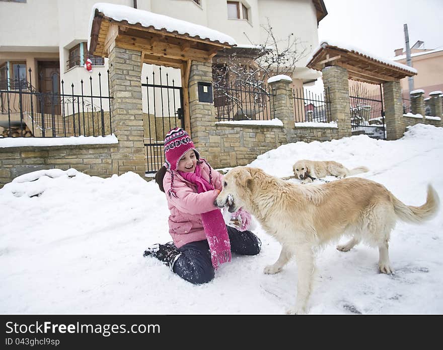 Little girl playing with her labrador friends. Little girl playing with her labrador friends