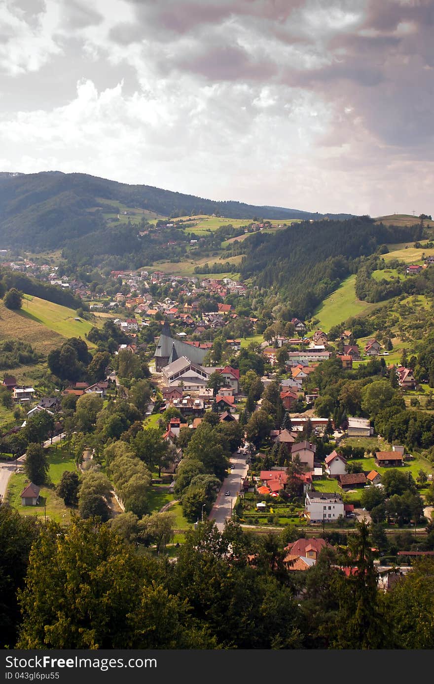 Vertical photo of a town in a mountain valley - Rytro, Poland. Vertical photo of a town in a mountain valley - Rytro, Poland