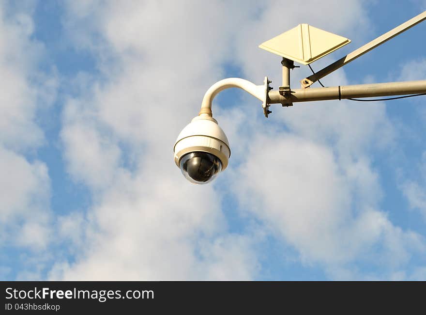 Image of a traffic camera on a beautiful blue sky