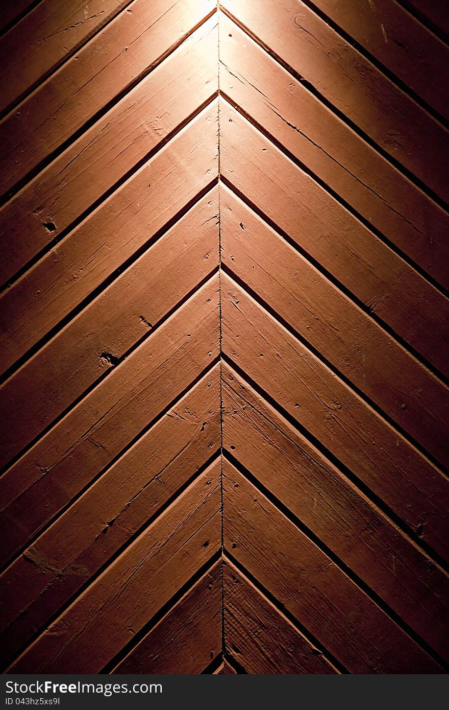 Detail of wooden door with light above