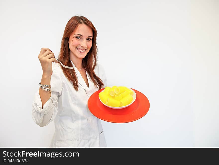 Beautiful woman doctor with a dish of curlers