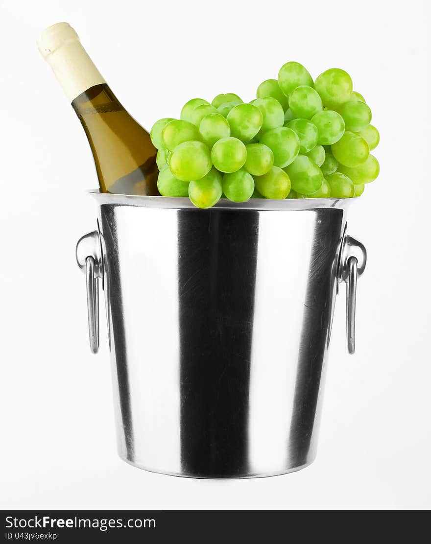 White wine bottle in cold ice bucket on white