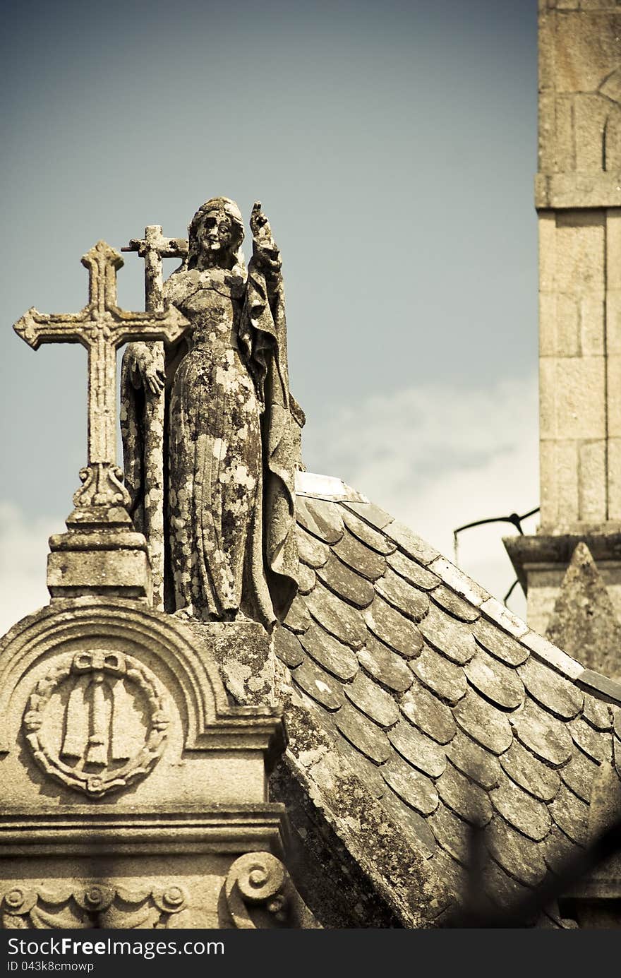 Detail Angel and Cross of a Catholic cemetery. Detail Angel and Cross of a Catholic cemetery