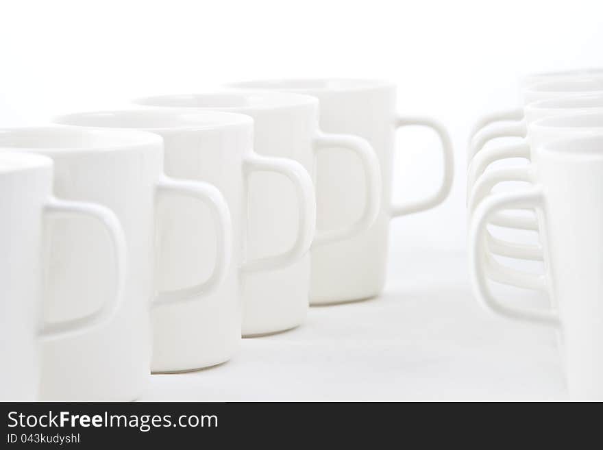 Line of white cups, on white background