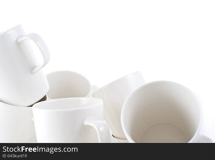 Many stacked of white cups on white background