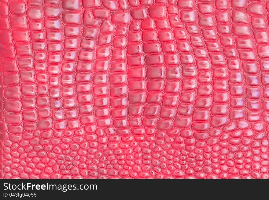 Red leather texture closeup, useful as background