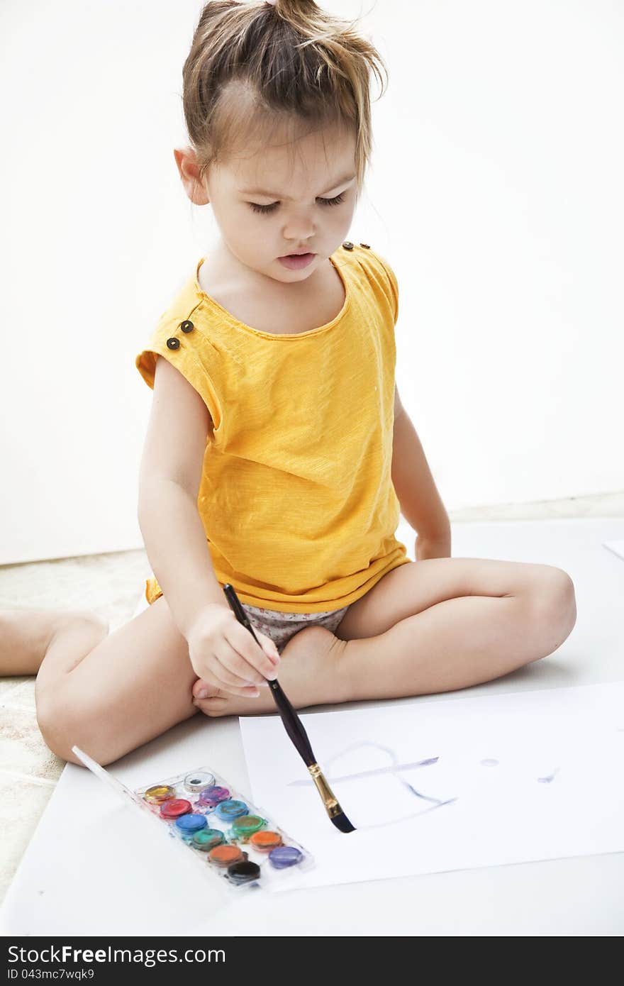 Girl draws a picture paints