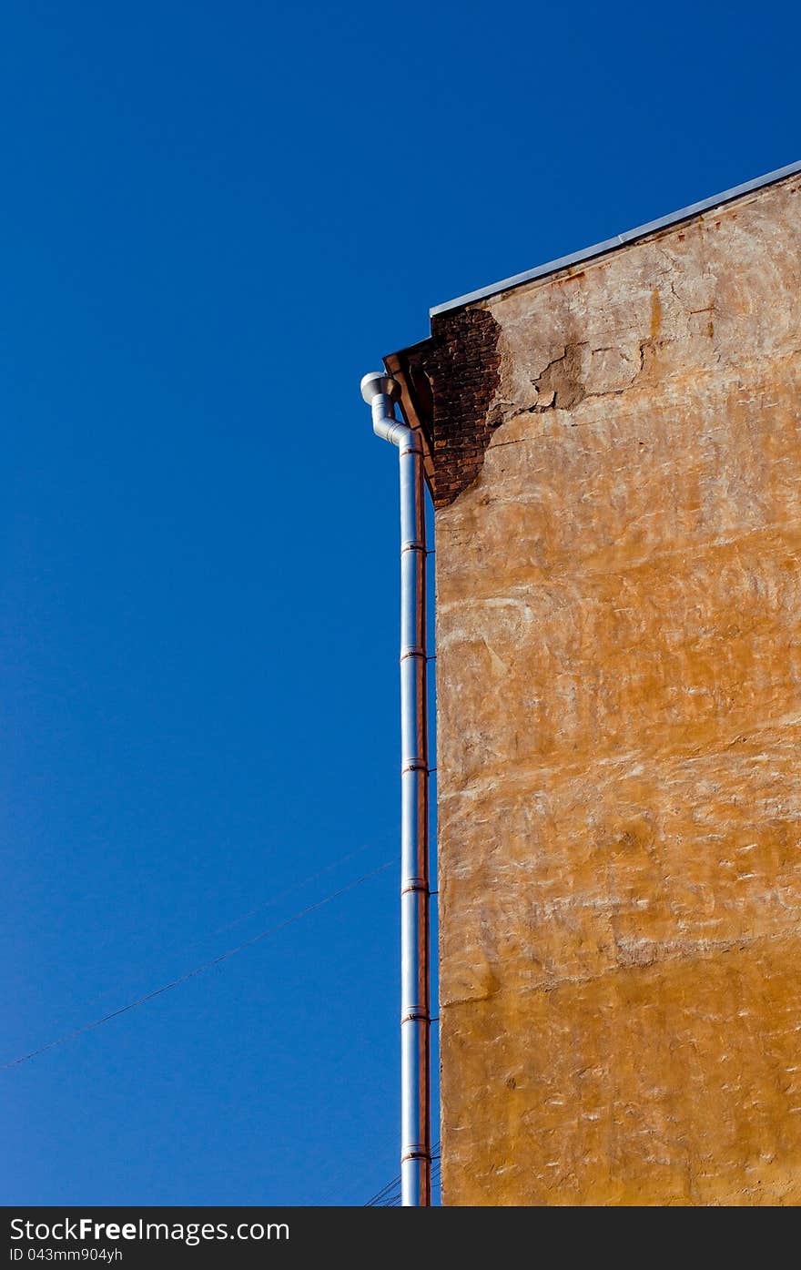 A wall of old house with gutte. A wall of old house with gutte