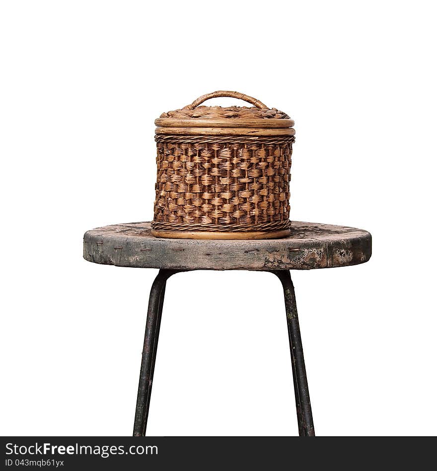 Basket wicker is Thai handmade on grunge chair isolated on white.