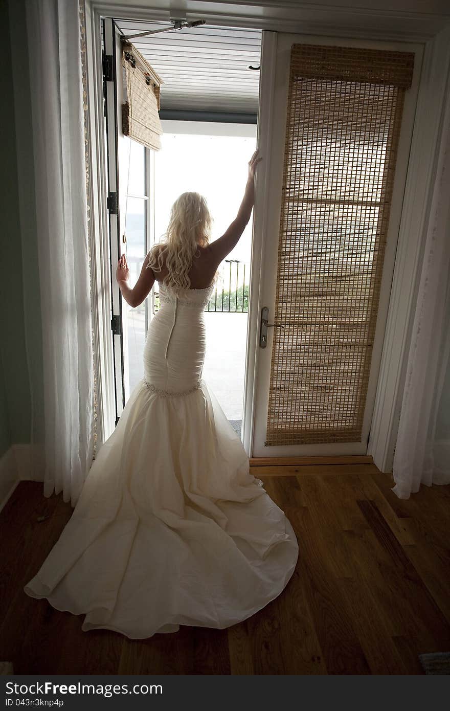 Bride in Front of an Open Door