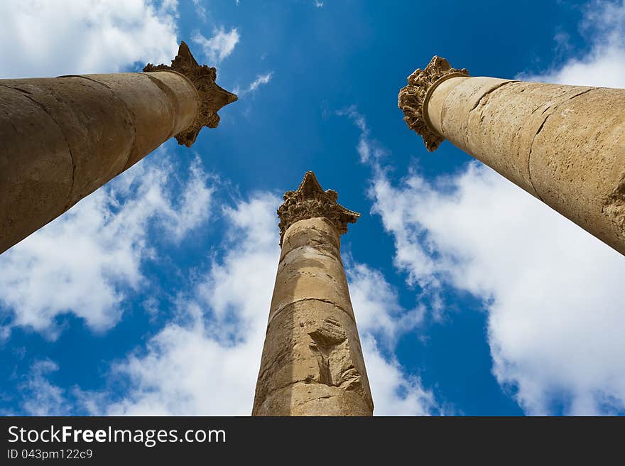 Columns toped with capitals reaching for the sky in the temple of Artemis at Jerash, Jordan. These mammoth pillars, built almost two millennia ago were designed to sway gently, absorbing the effects of earth tremors and high winds. Columns toped with capitals reaching for the sky in the temple of Artemis at Jerash, Jordan. These mammoth pillars, built almost two millennia ago were designed to sway gently, absorbing the effects of earth tremors and high winds.