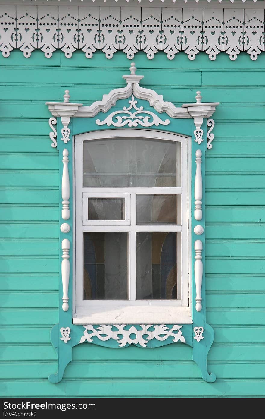 Window of the ancient wooden house in the city of Mariinsk, Siberia. Window of the ancient wooden house in the city of Mariinsk, Siberia.