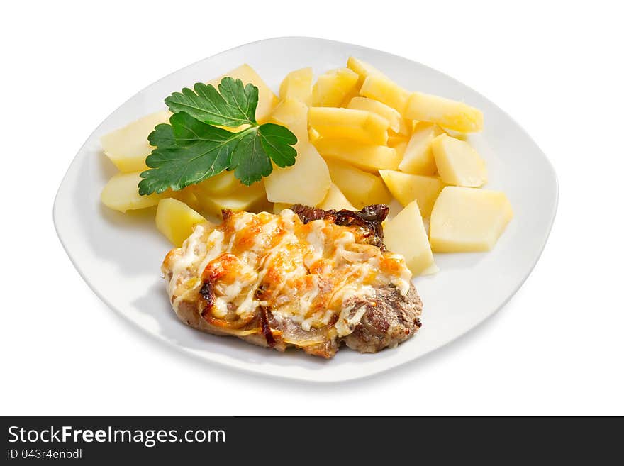 Pork chop with potatoes on white plate, isolated. Pork chop with potatoes on white plate, isolated