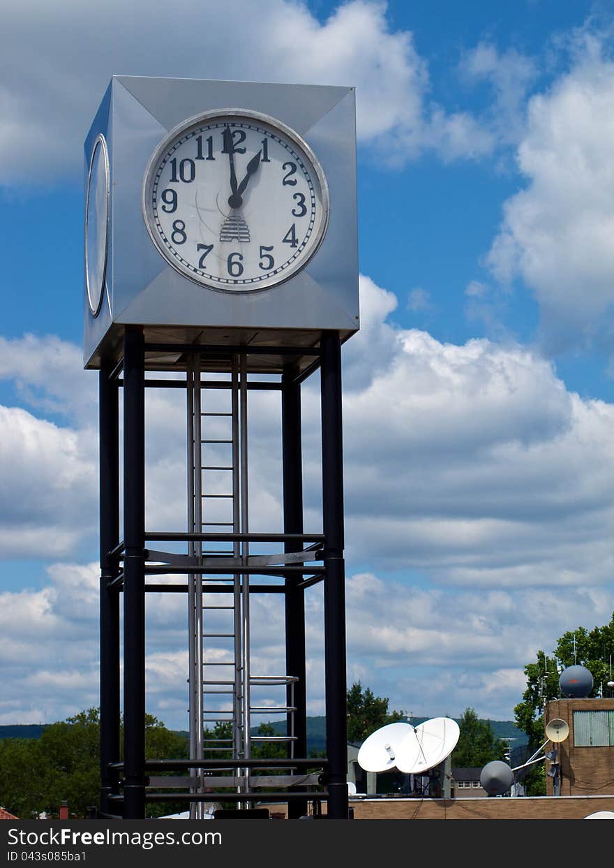 Modern Cube-Shaped Clock Tower In Mountain Setting