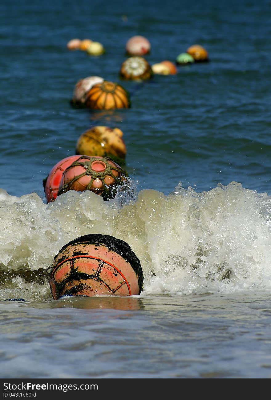 Buoys floating at the surface of the ocean. Buoys floating at the surface of the ocean.