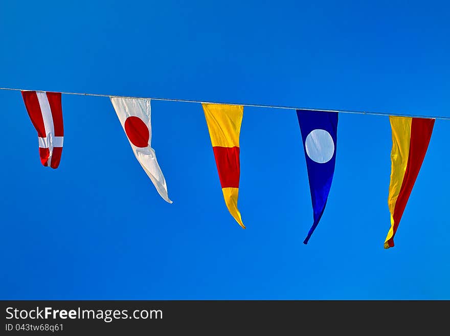 Signal flags in blue sky