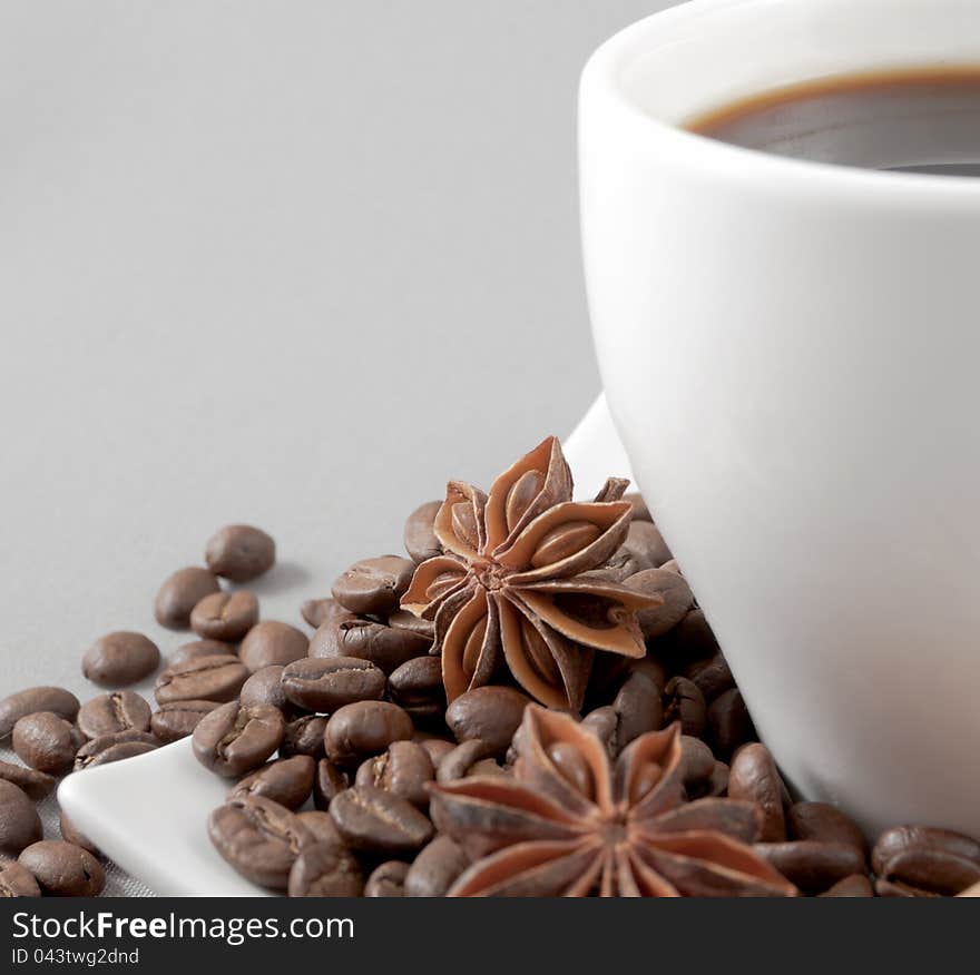 Coffee, grains, anise on a grey background