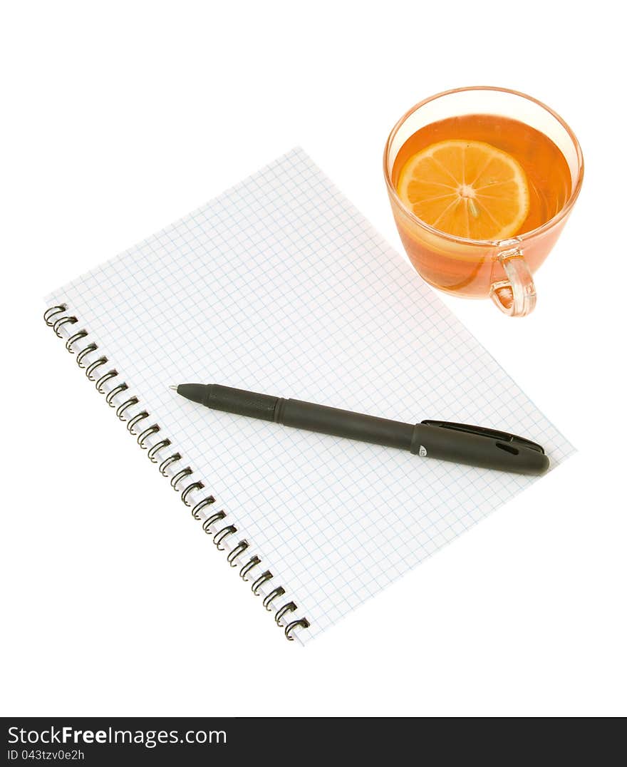 Notebook with a pen and tea with a lemon